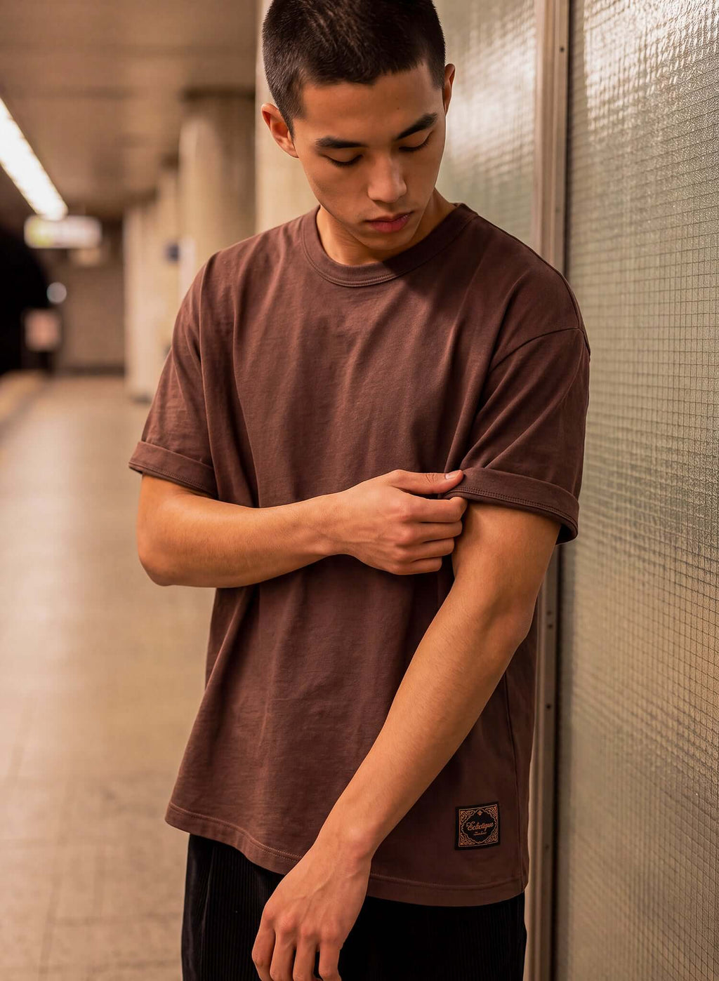 Men's Chocolate Brown Cotton T-shirt – Essential worn by a young man in a casual setting.