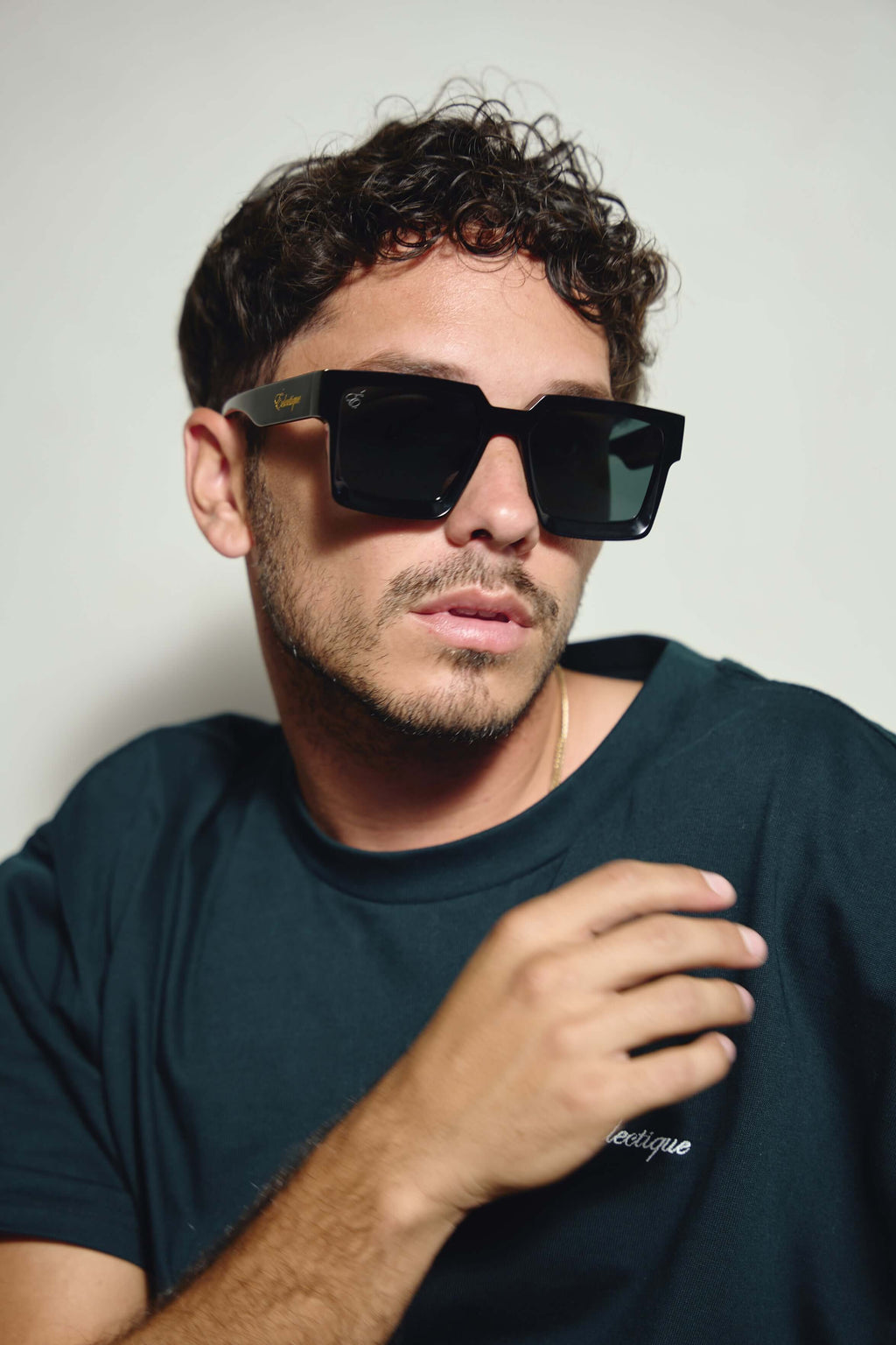 Close-up of Éclectique polarized black sunglasses on model
