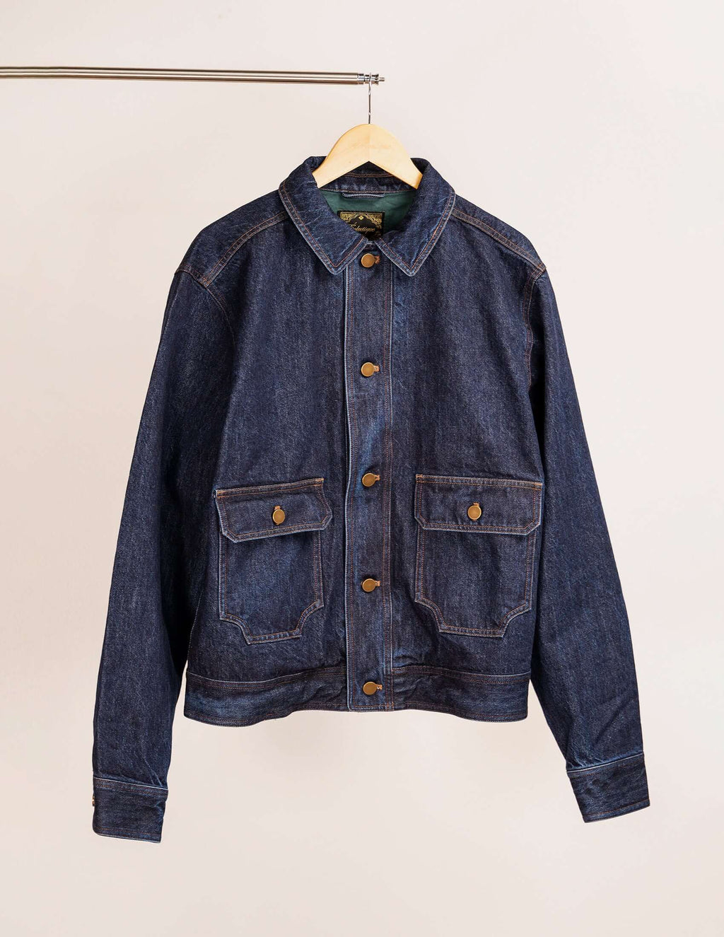 Men's indigo denim jacket – Kura, featuring copper stitching and distinctive throat latch collar.