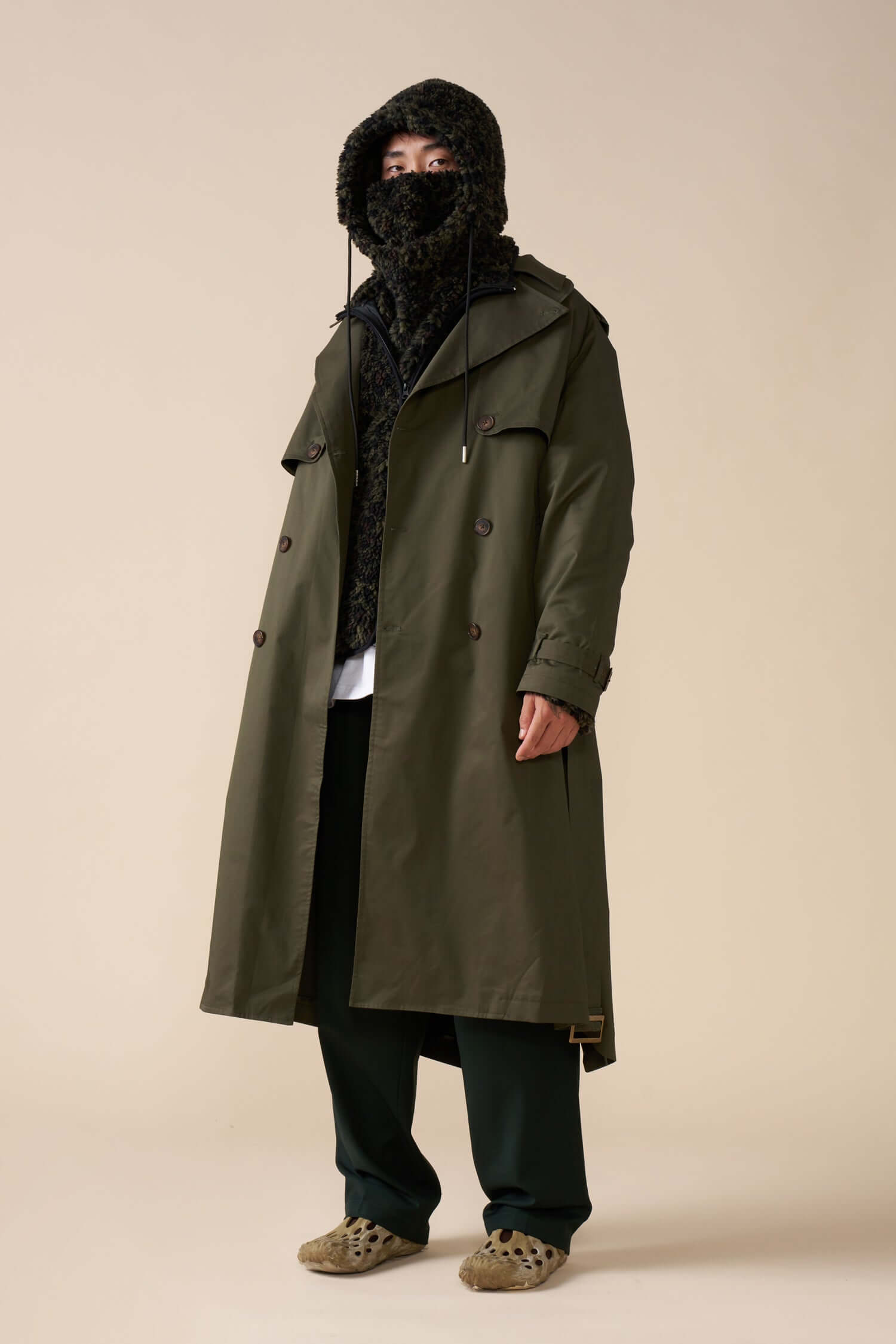 front quarter view of model wearing Men's Olive Trench Coat