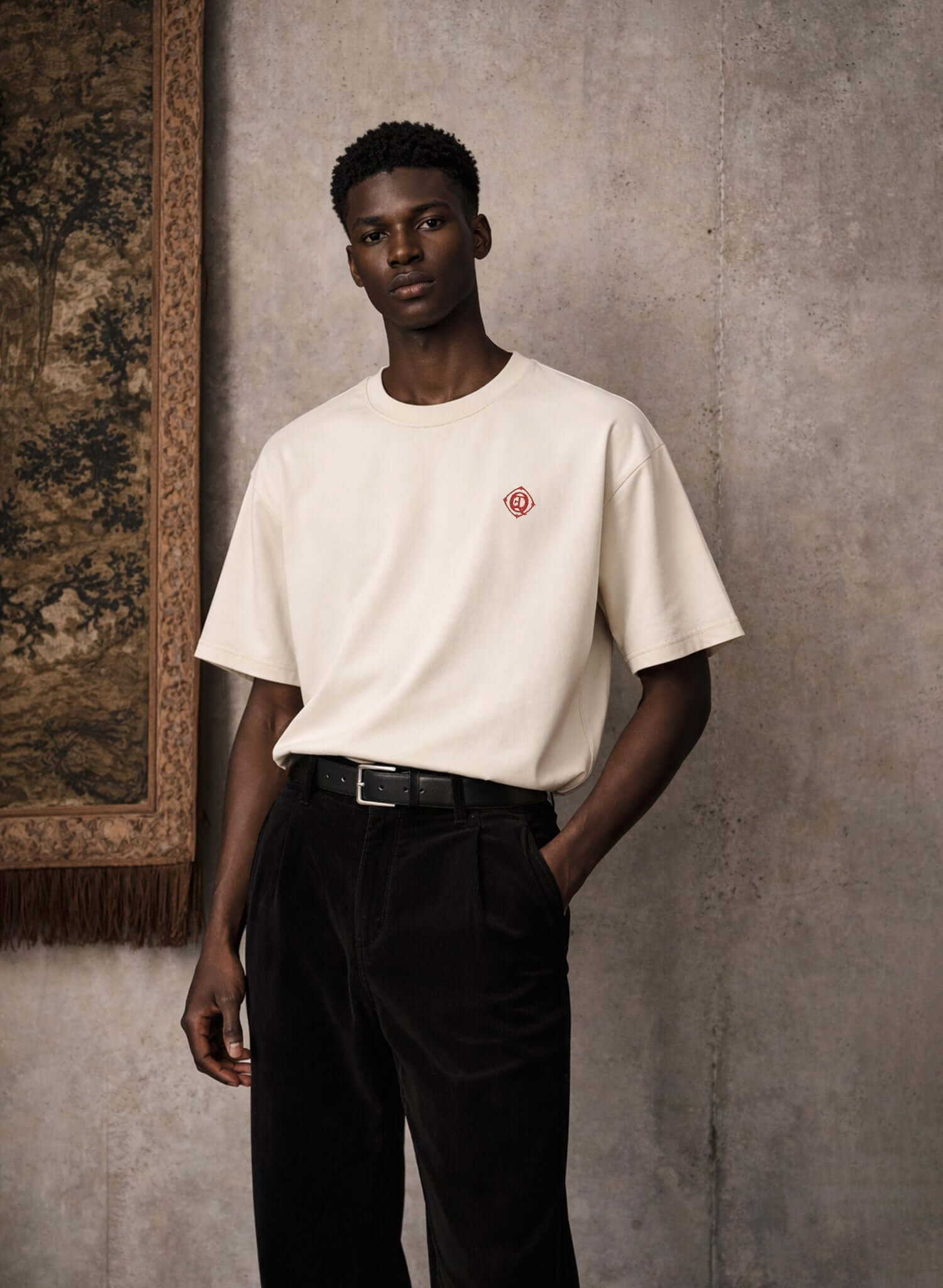 Monogram embroidered cotton t-shirt in French vanilla worn by a model, featuring a discreet embroidered logo.