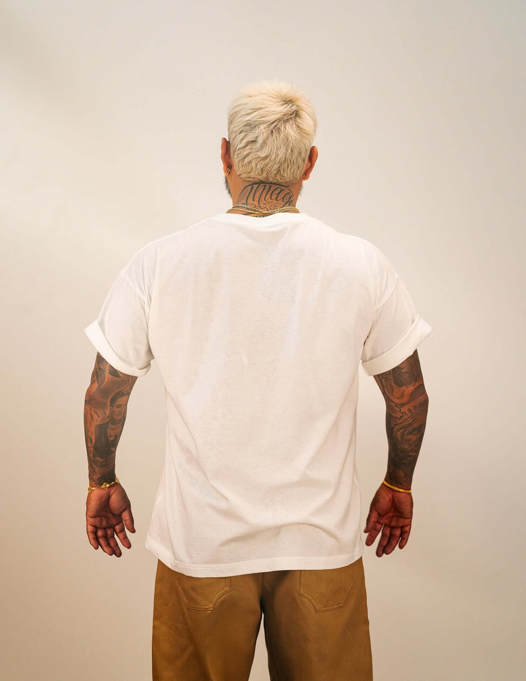 Men's White Cotton T-shirt worn from the back showcasing the relaxed fit and sleeve design.