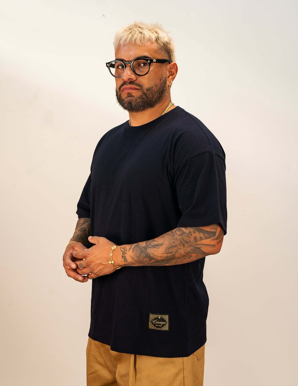 Men's navy cotton t-shirt worn by a man with glasses, showcasing a relaxed fit and deep navy color.