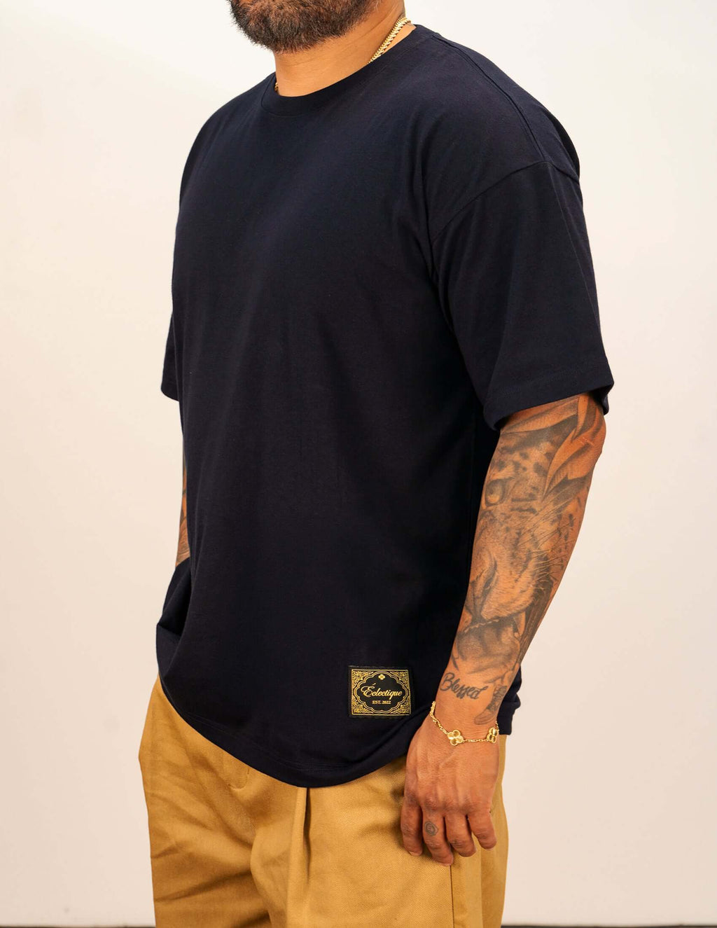 Men's navy cotton t-shirt worn by a man, featuring relaxed fit and crew neckline.