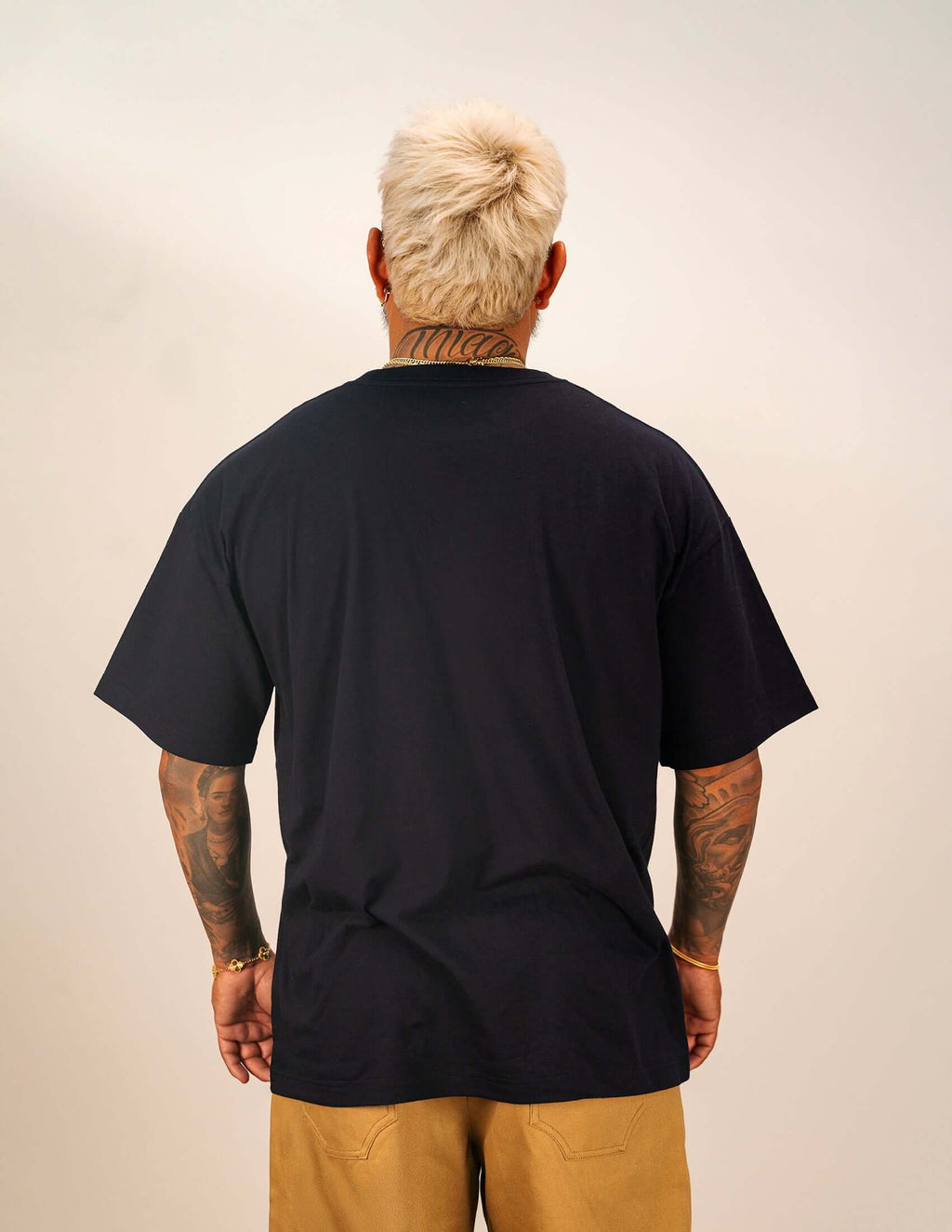 Men's navy cotton t-shirt showcasing a relaxed fit and back view on a model.