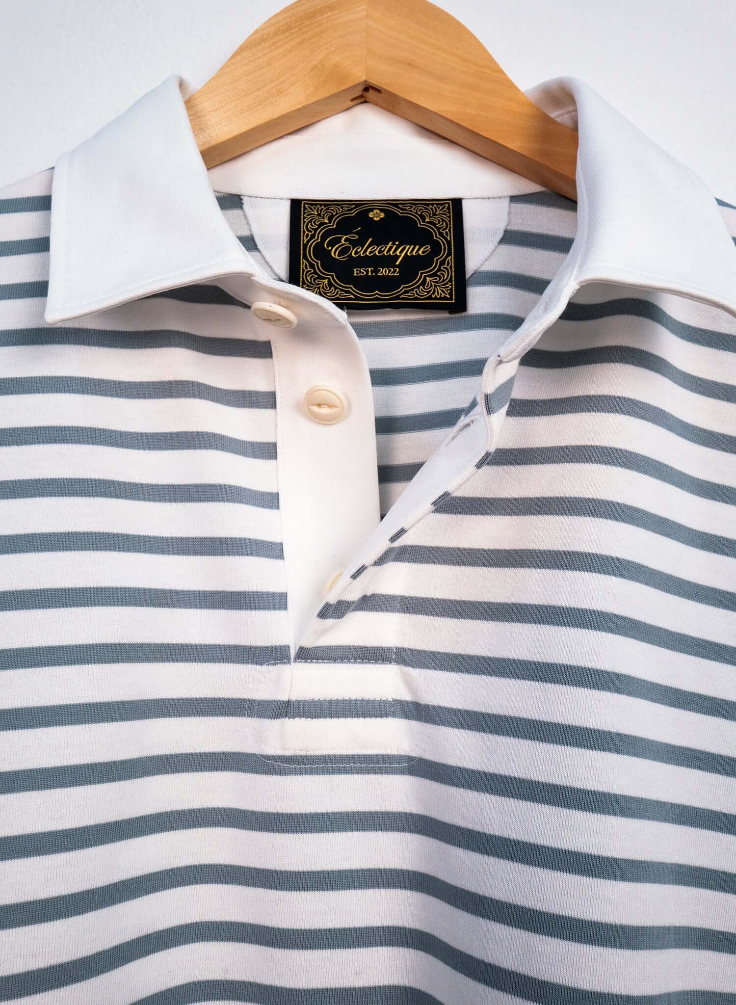 Striped Long Sleeve Rugby Shirt featuring blue-grey horizontal stripes and a crisp white collar