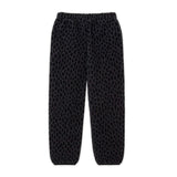 Black Leopard fleece pants featuring a cozy design and tapered silhouette for casual and comfortable wear.