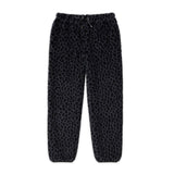 Black Leopard fleece pants featuring a soft fabric and relaxed fit, ideal for casual wear and travel.