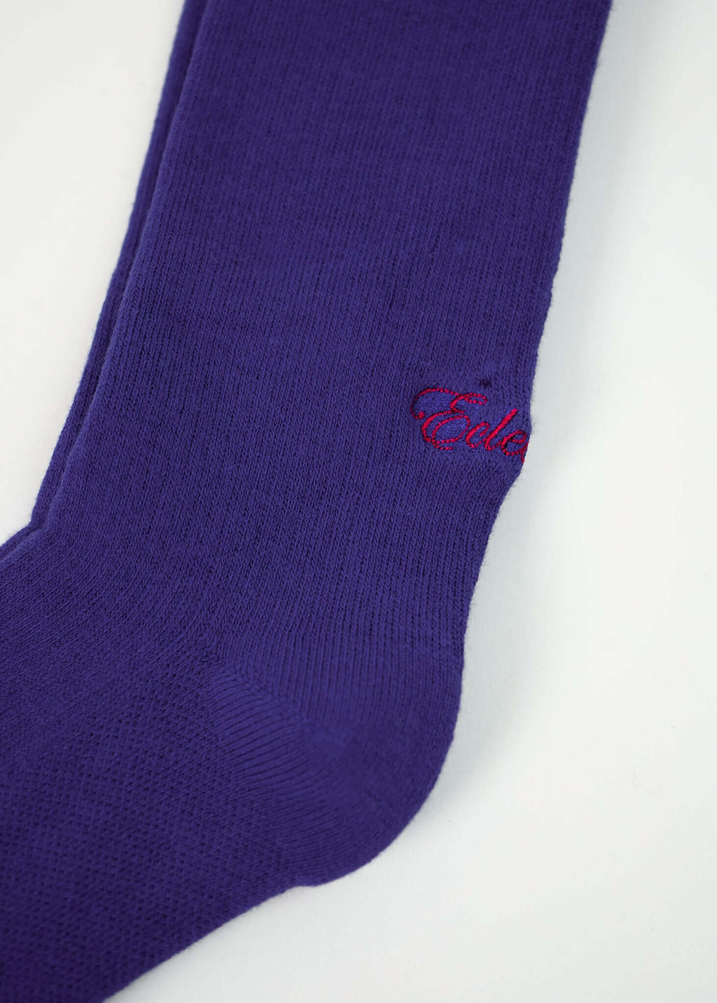 Blue crew socks from Éclectique in a vibrant shade of purple with smooth knit construction.