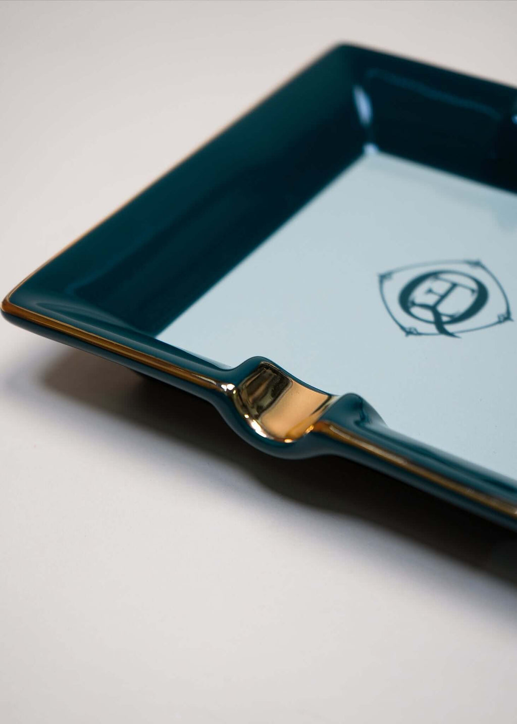 Ceramic Cigar Ashtray with gold trim and monogram logo, elegantly designed for jewelry or as an ashtray.