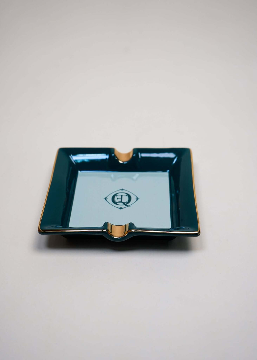 Ceramic Cigar Ashtray with gold trim, green finish and logo, perfect for jewelry or small essentials.