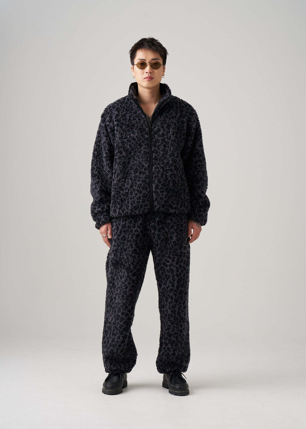 Black leopard fleece jacket styled on model by Éclectique