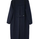 Back view of the Éclectique Kanso Collarless Long Coat showcasing its minimalist design and structured silhouette.