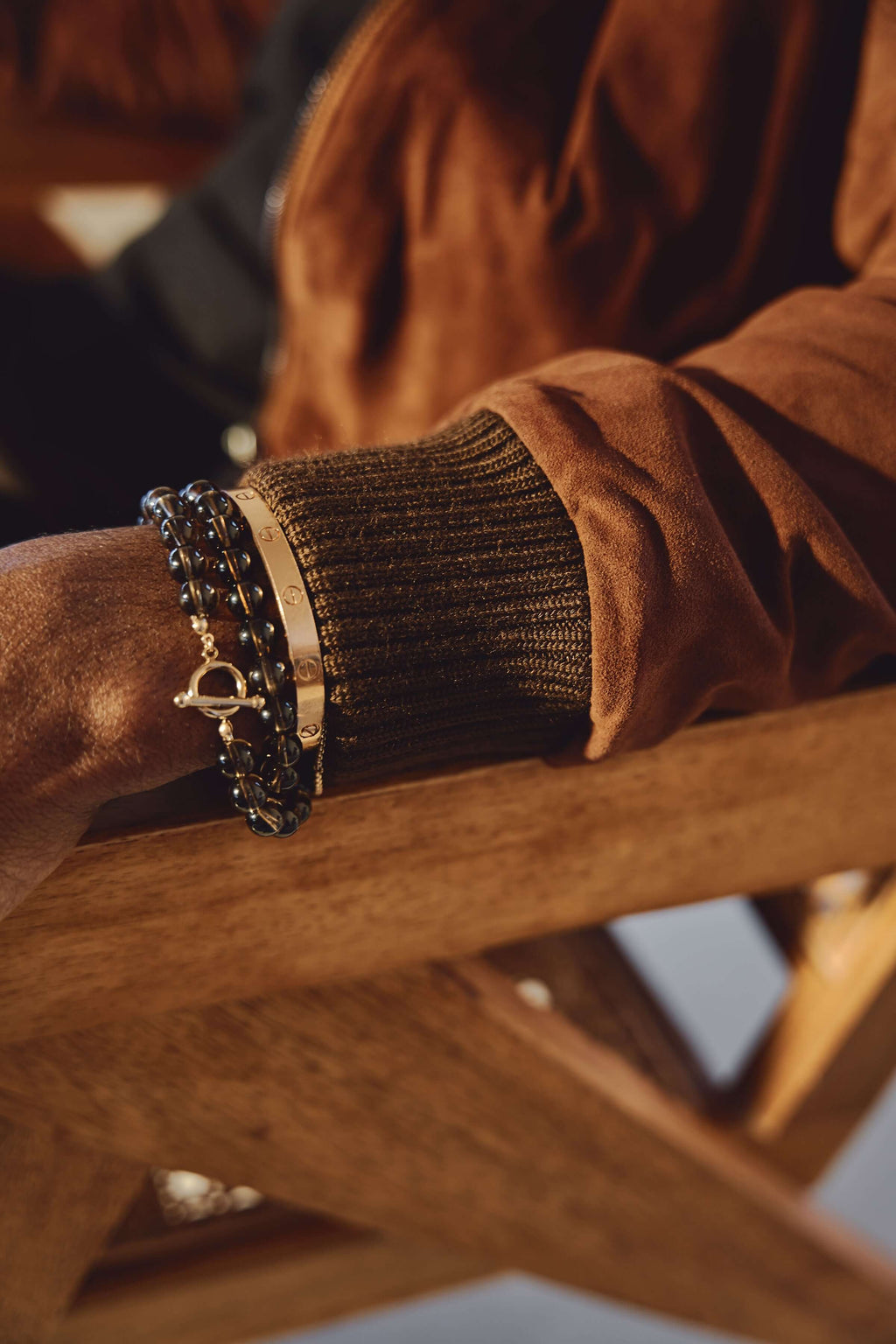 Ribbed cuff and sleeve detail on Éclectique Italian suede bomber jacket in brown
