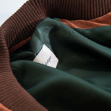 Interior lining and label detail of Éclectique Italian suede bomber jacket in brown