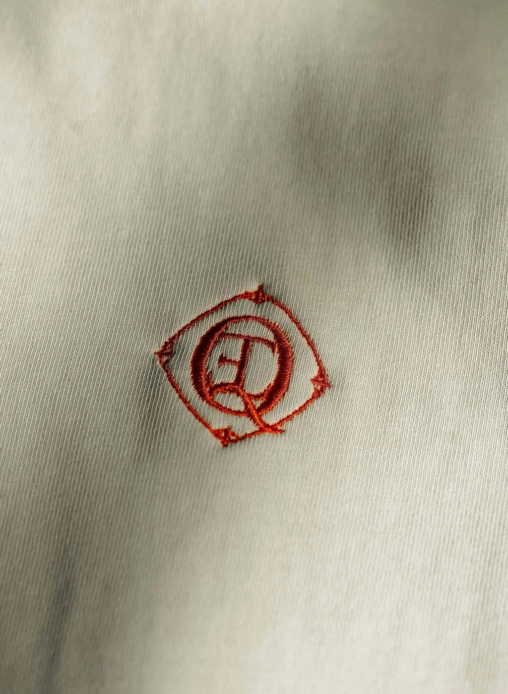Embroidered monogram logo on monogram embroidered cotton t-shirt in French vanilla.