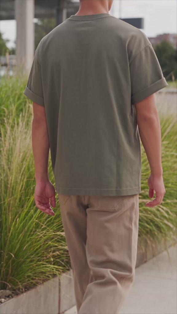 Men's olive cotton t-shirt in Kalamata, worn by model outside