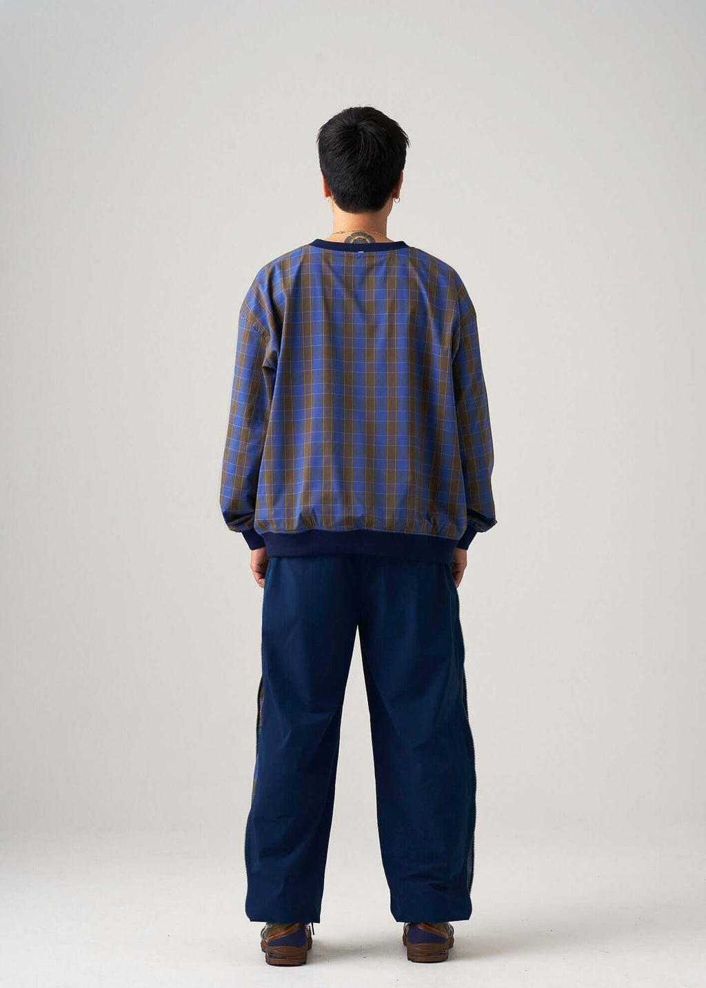 Oversized reversible windbreaker jacket in Navy styled by model back view