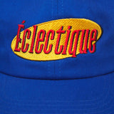 Close-up of the Éclectique embroidered logo on a royal blue Vintage logo hat.